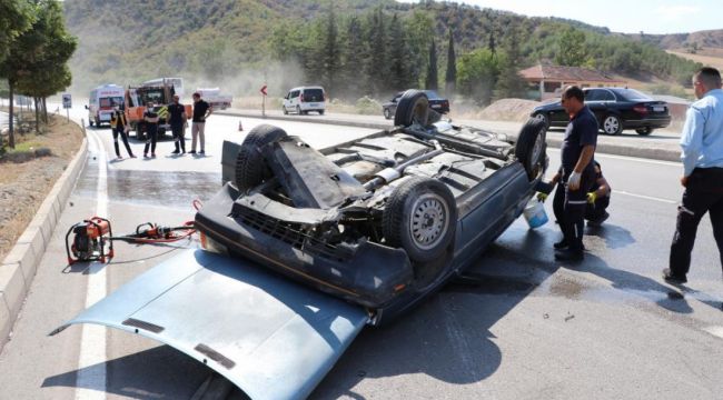 Takla atan otomobilden burnu bile kanamadan kurtuldu