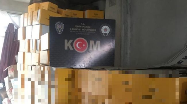 İZMİR'DE KAÇAK GÜNEŞ KREMİ DEPOSUNA BASKIN