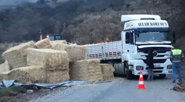 Saman yüklü tır virajı alamayınca devrildi