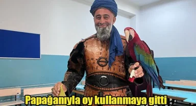 Papağanıyla oy kullanmaya gitti