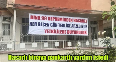 Hasarlı binaya pankartlı yardım istedi